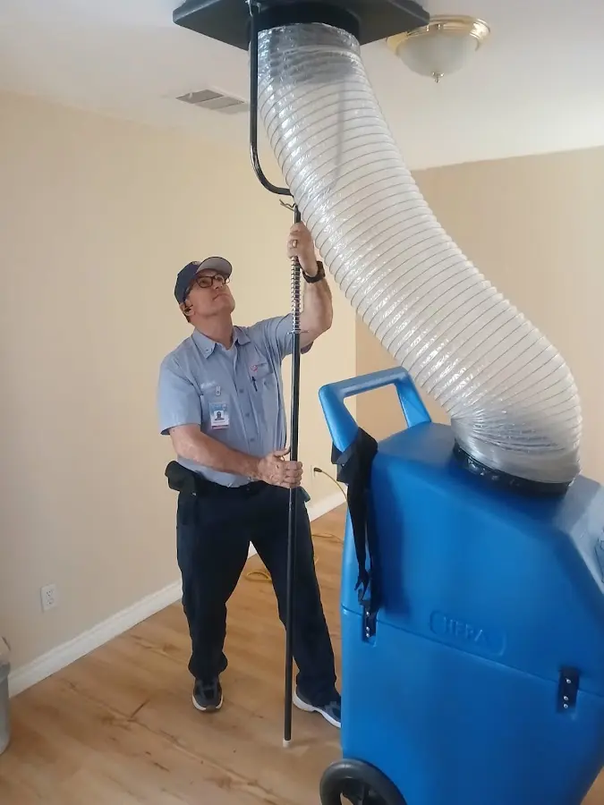 Furnace Tune-Up technician using HEPA equipment in Mount Vernon
